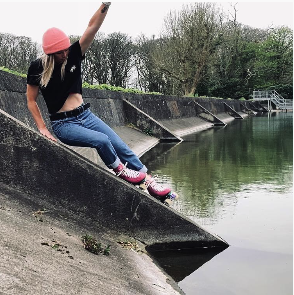 Jess skating by a river using our flash lighting ceramics